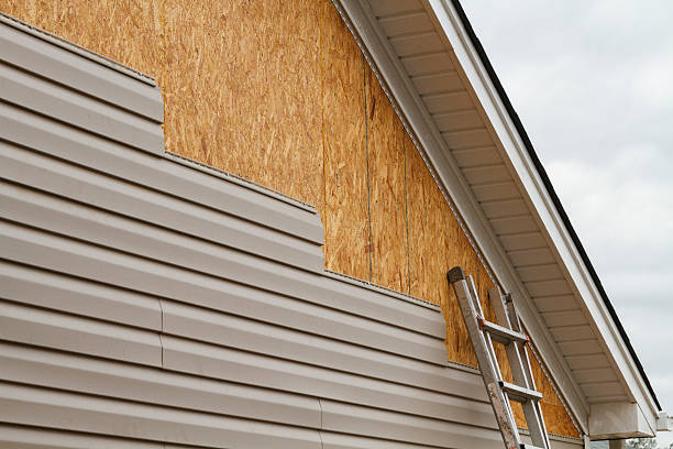 Professional Siding technician working in Clifton, VA